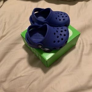 Blue crocs, size 2/3, brand new. Never worn.